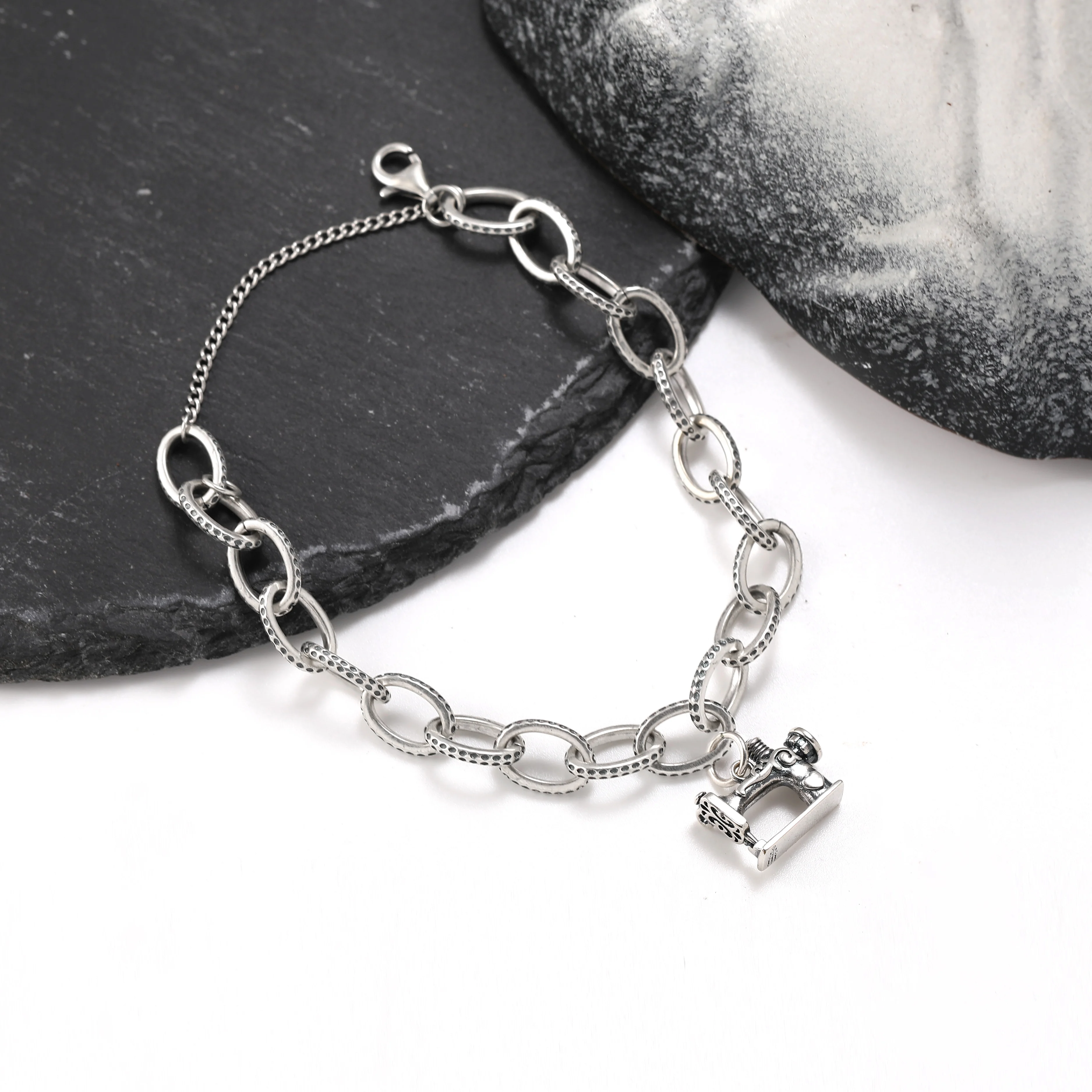 

Genuine 925 sterling silver exquisite Textured Oval Charm Bracelet paired with Old-fashioned sewing machine pendant