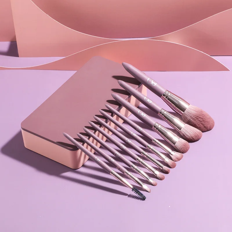 

Самый продаваемый набор из 10 фиолетовых портативных кистей для макияжа с зеркальной коробкой