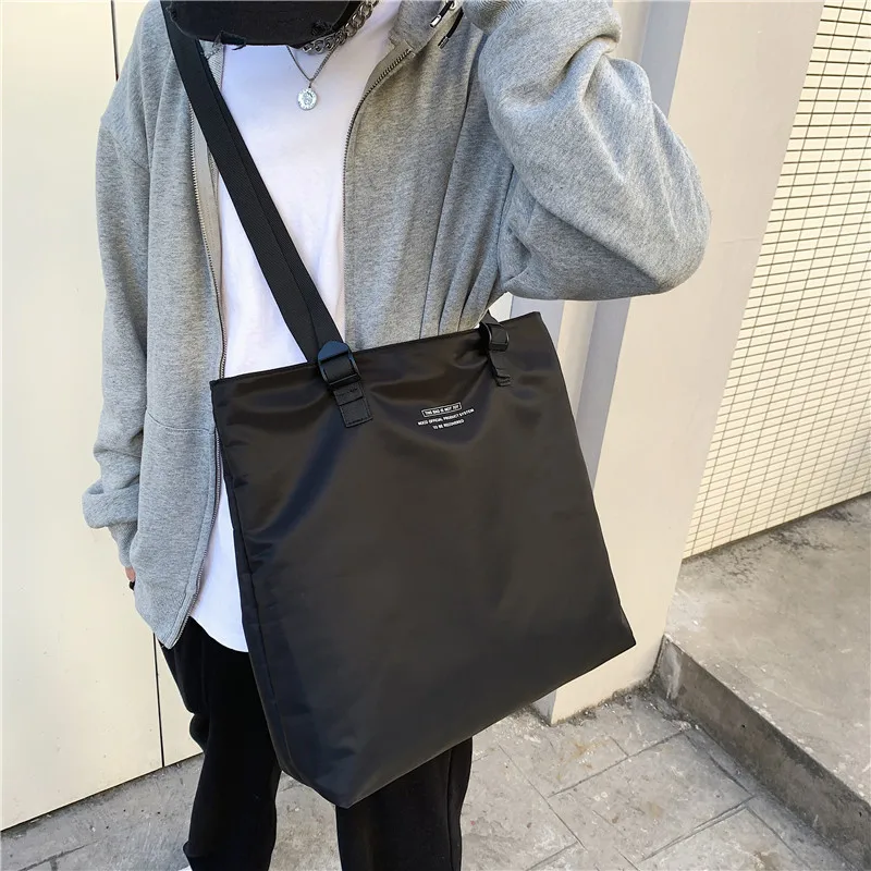 Large-capacity Korean version of male and female students slung light travel bags portable shoulder bags to store shopping bags.