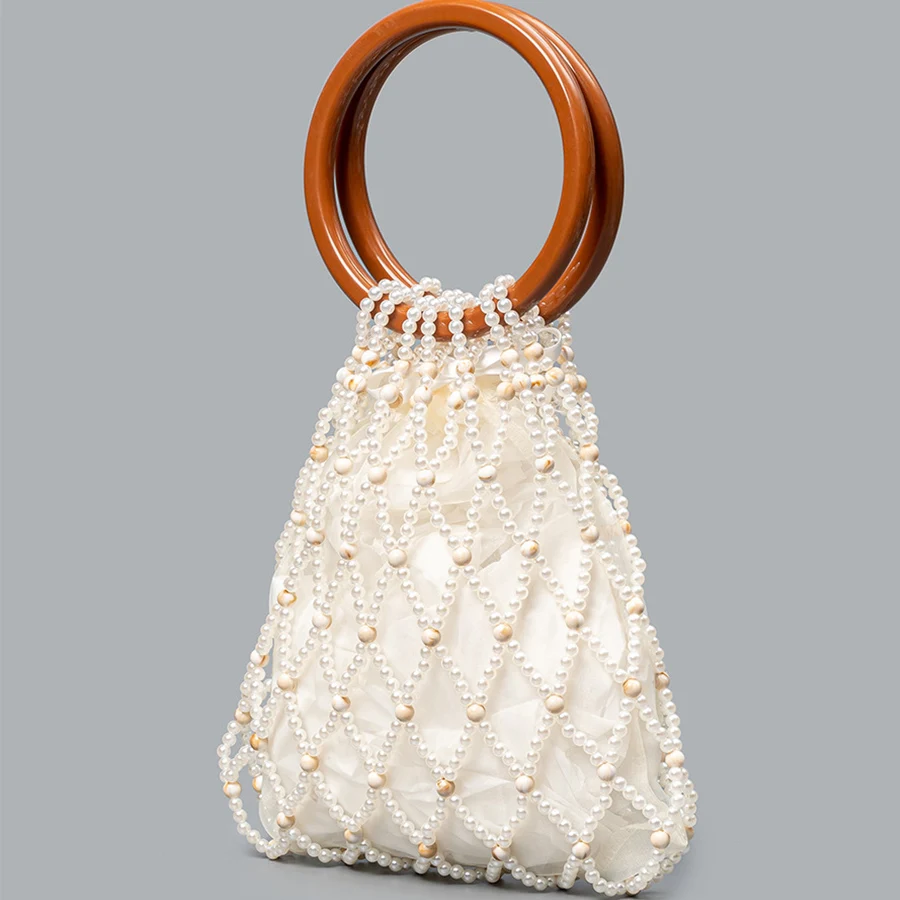 

Contrasting-color woven bag New style open-string beaded bag Beach vacation handbag Casual travel hollow out Beach Women's bag