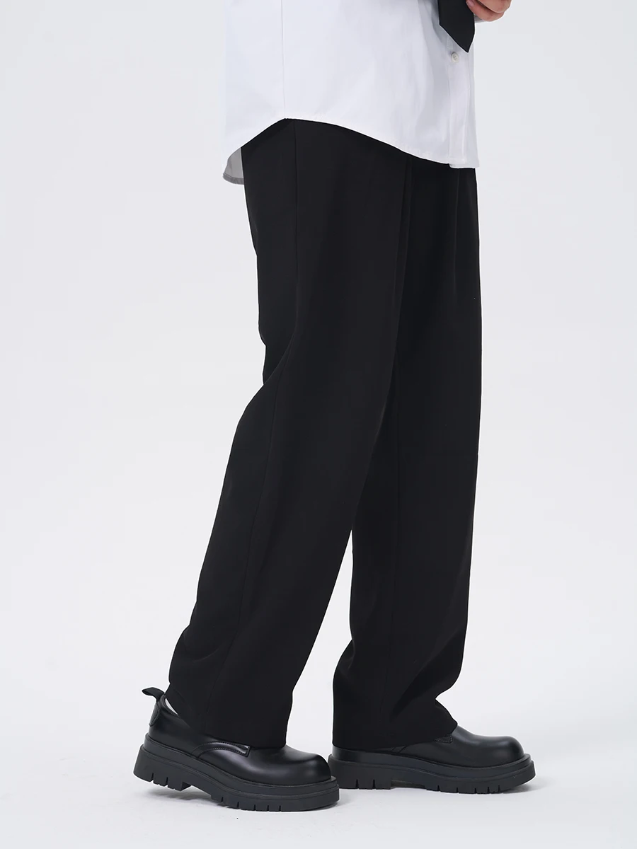 Spodnie do pracy Cookawu Commuter o prostych nogawkach, z półelastyczną talią, podstawowe, lejące się, wyszczuplające, uniwersalne, neutralne, w kolorze czarnym.