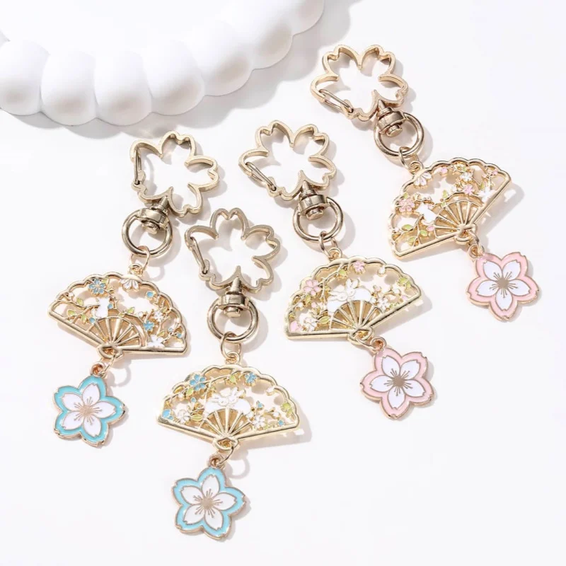 LLavero de esmalte dulce con abanico hueco de flor de cerezo, bonito llavero de animales de conejo para mujeres y niñas, joyería hecha a mano, buen regalo