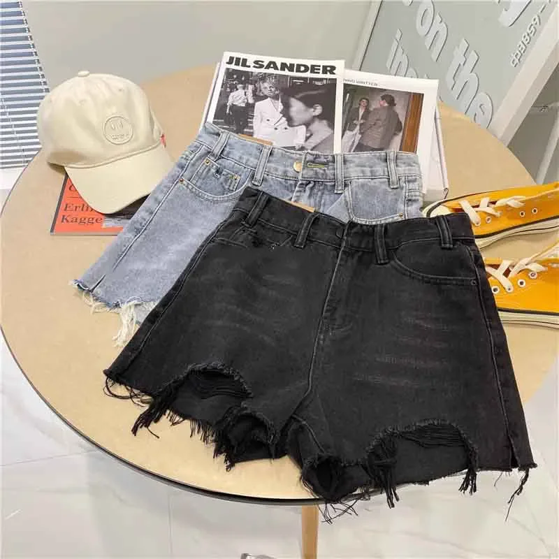 

2025 летние новые джинсовые шорты с высокой талией и кисточками, женские джинсовые шорты в Корейском стиле с широкими штанинами и необработанными краями, свободные черные, синие джинсовые шорты