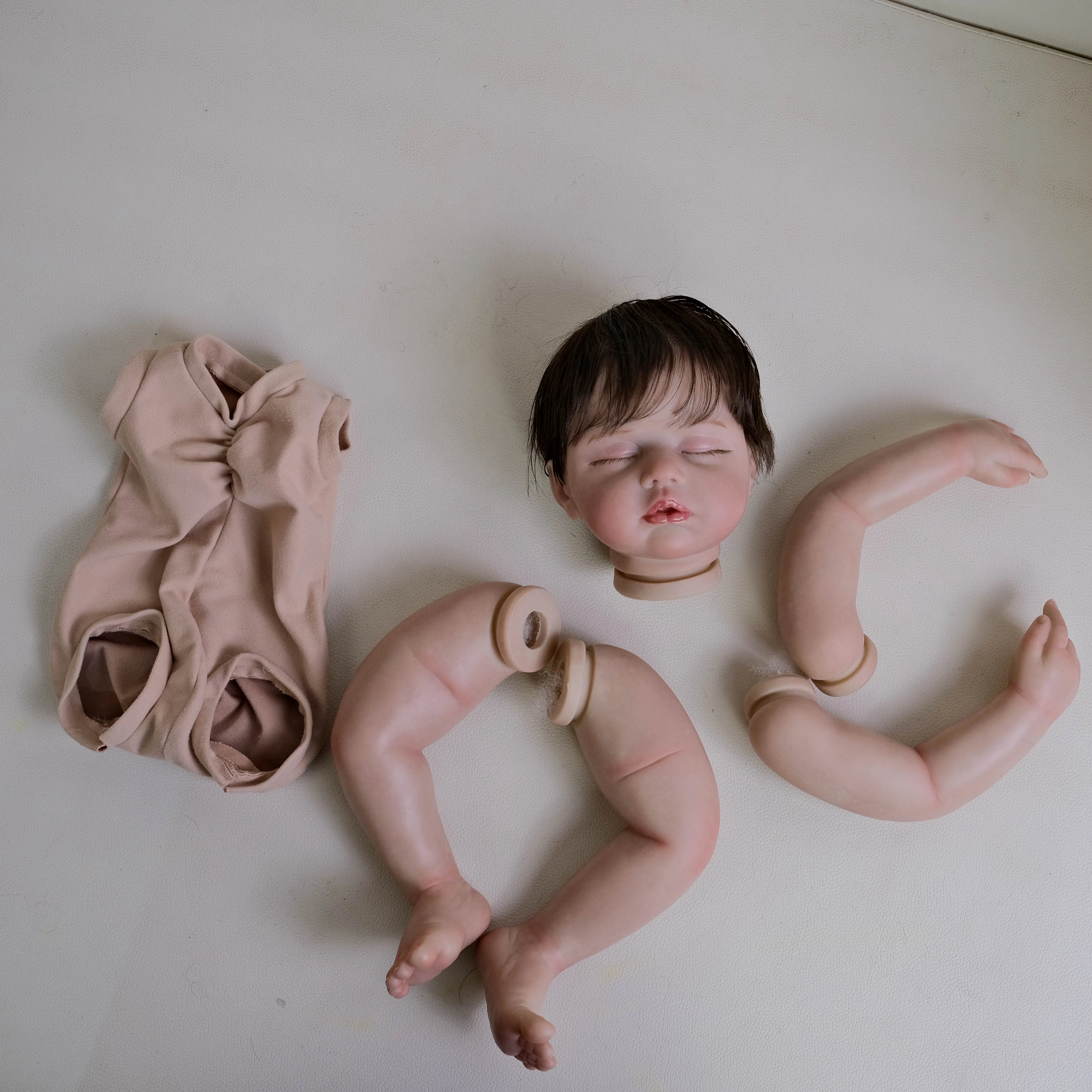 NPK 19inch Zoey Unfinished Painted Doll Kit Reborn Doll Parts with Hand Rooted Brown Hair Lifelike Doll for Collectors