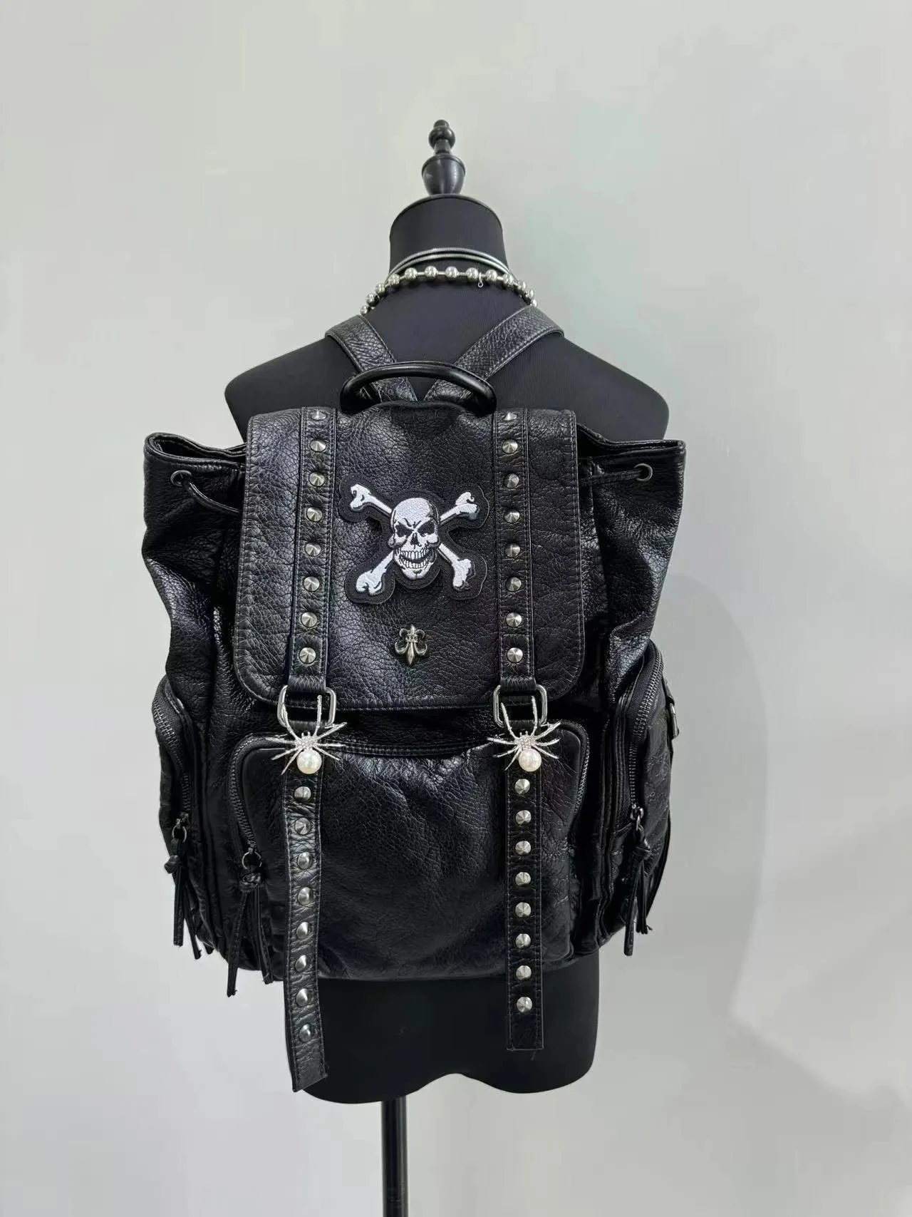 Black Gothic Skull Rivet Backpack Y2K Punk Spider Pearl Skull Crossbones Backpack Faux Leather Drawstring Rucksack for Women