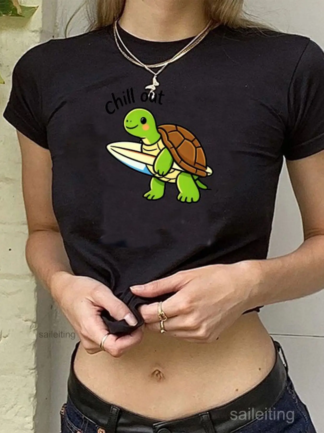 Women's Black Short Sleeve Crop Top with Cartoon Green Sea Turtle Surfing Print 