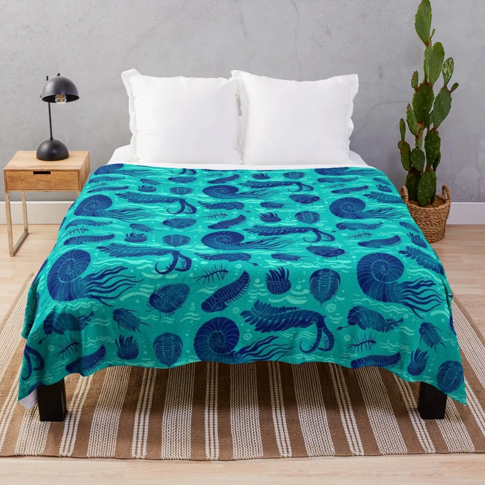 

Ancient sea animals: Trilobites, Anomalocaris, Wiwaxia and others on green background Throw Blanket Sofas Flannels Blankets