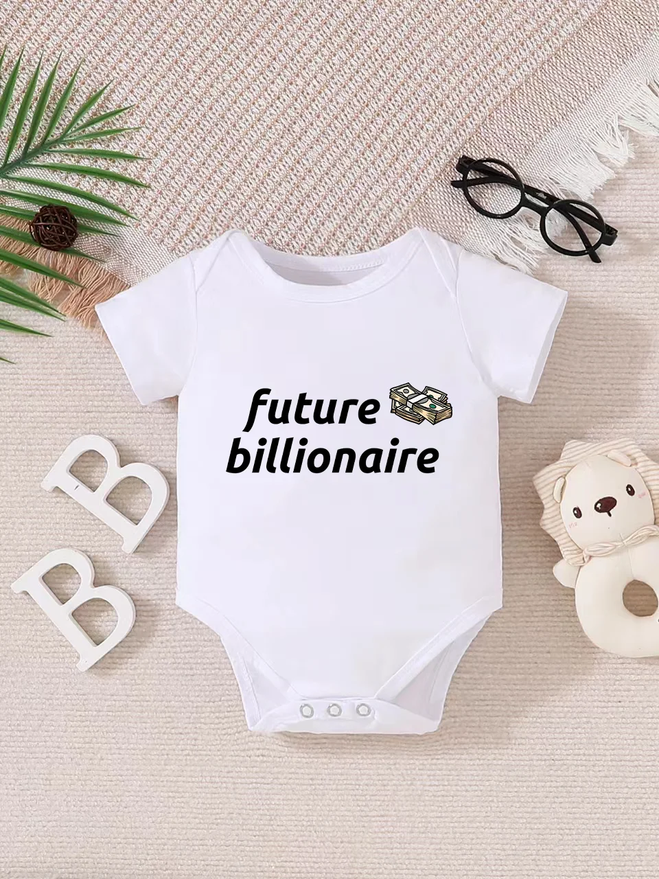 Playful letter-printed baby short-sleeve triangle bodysuit. Button closure for easy dressing, machine washable