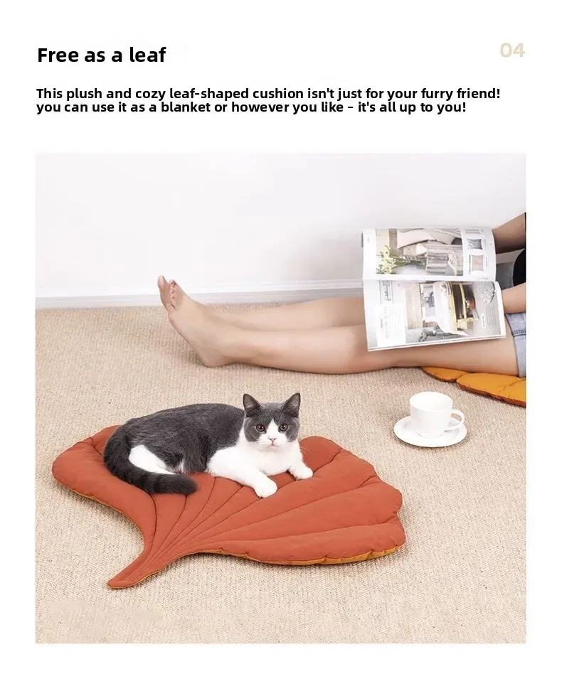 A grey and white cat lying on a grey and white Leaf Pattern Cat Sleeping Mat on the floor.