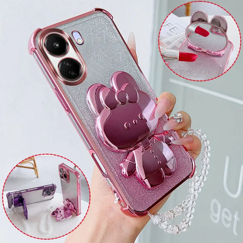 Luxuriöse stoßfeste Handyhülle mit niedlichem Hasen-Make-up-Schwenkständer und Kristall-Lanyard für Xiaomi Redmi 13C 4G Poco C65 Rückseite.