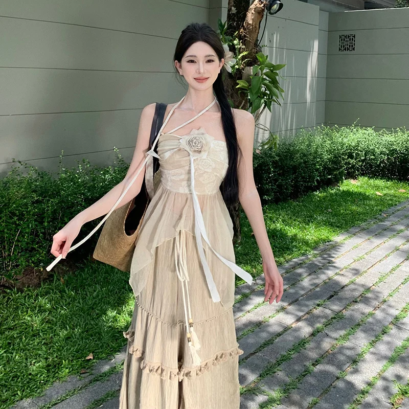 Completo estivo da donna in cotone e lino con top a fascia, pantaloni a gamba larga con nappe e gonna a vita alta in poliestere...