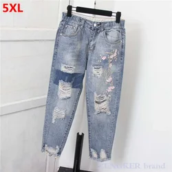 New plus size women's nine-point hole denim harem pants loose beggar ankle-length cross pants ripped jeans for women