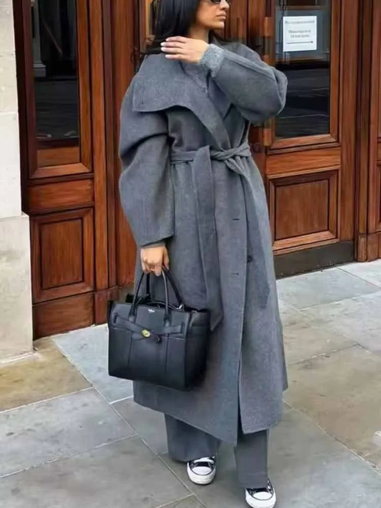 

Европейский и американский стиль, женское осеннее новое модное трендовое пальто с воротником-стойкой, поясом и длинными рукавами, на одной пуговице.