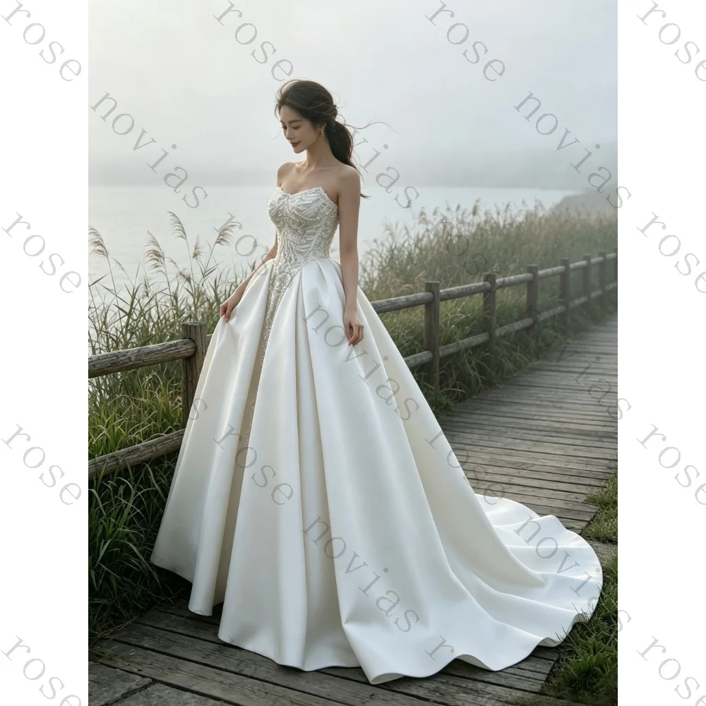 Customized Luxury Strapless Beaded Corset Satin A-line Wedding Dress 2026 Romantic Strapless Long Trailing Pleated Bridal Gown