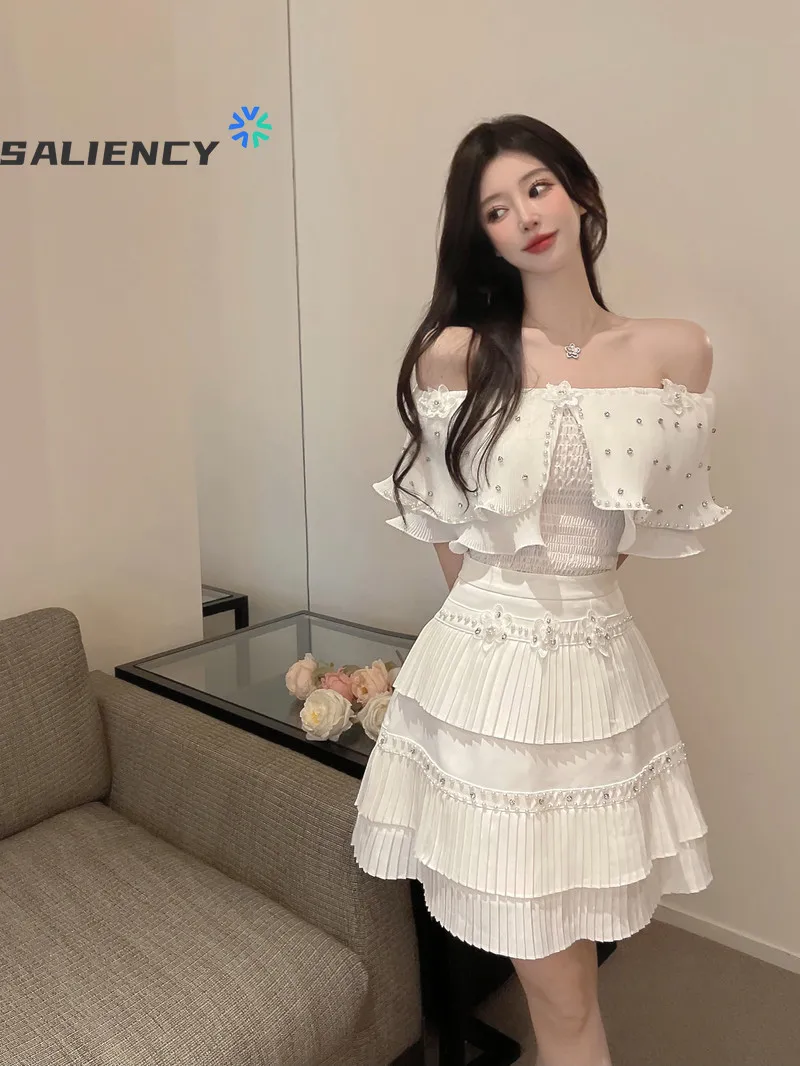 

Женское платье с оборками, модный костюм из двух предметов, белый топ с открытыми плечами и плиссированная мини-юбка принцессы