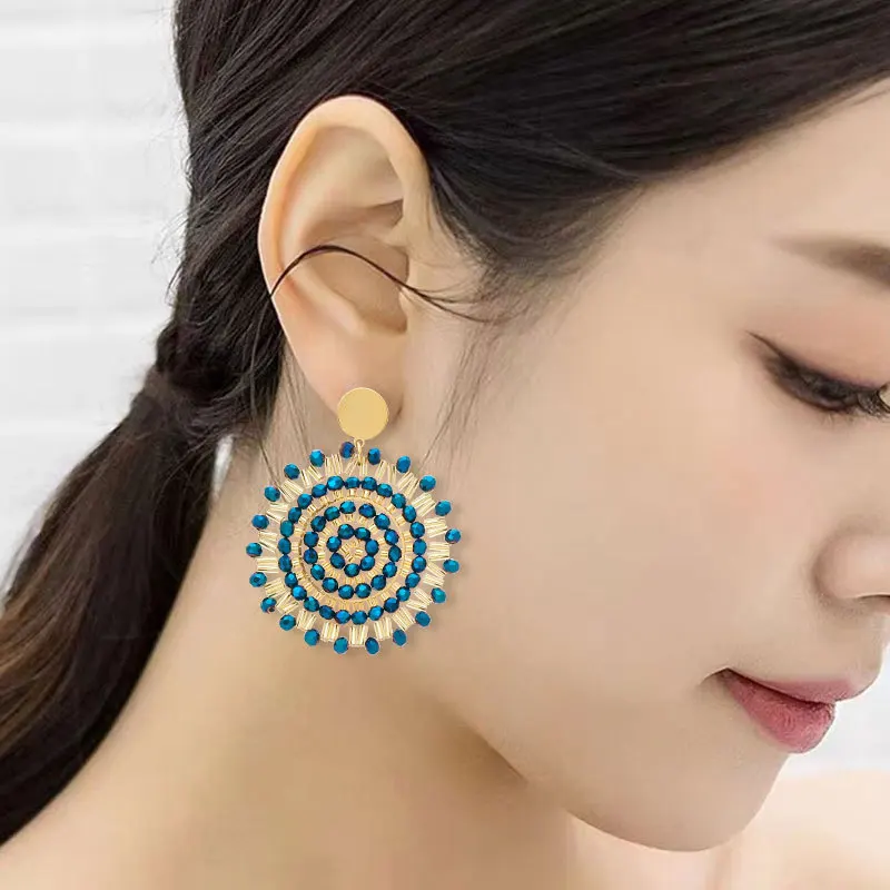 

Beaded earrings Hollowed-out Crystal Bohemia Sunflower Design Hand knitting Alloy Female Tide Simple Rice bead earrings