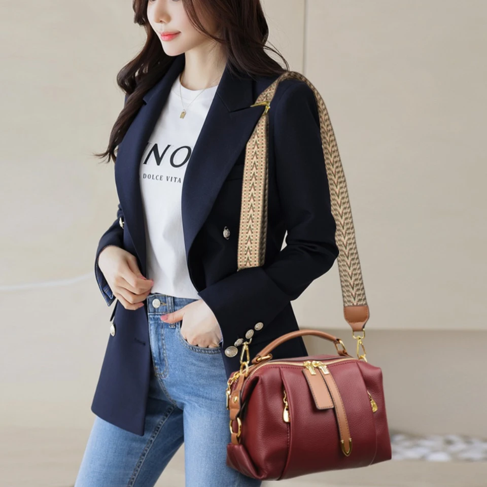 Bag worn crossbody on model in urban setting