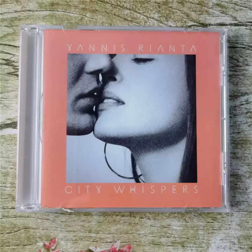 

CD Yannis Rianta City Whispers. Жанр: фьюжн, сочетающий инди-фолк и амбиент-музыку, с минималистичными аранжировками и нежной гитарой.