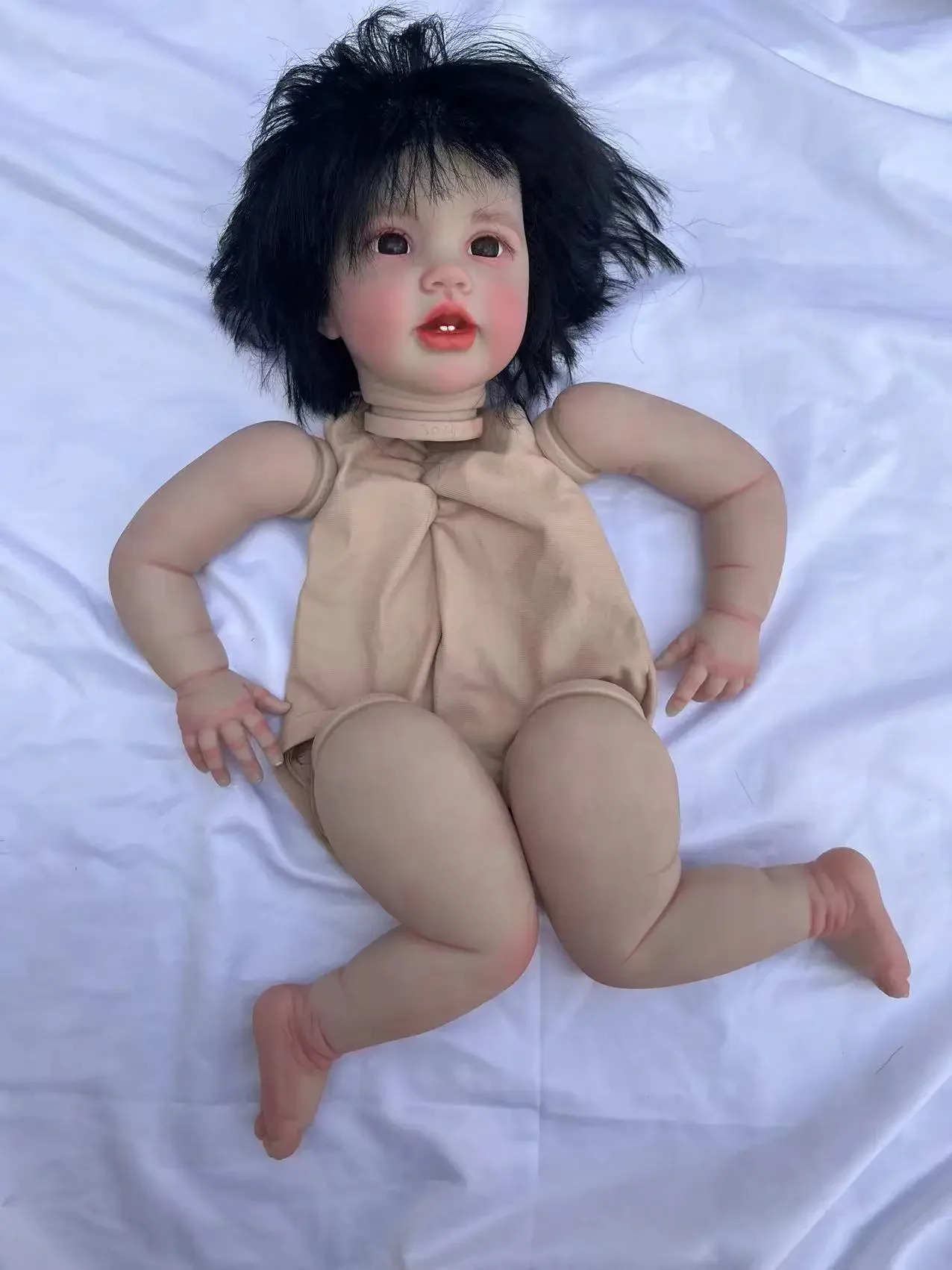 Customized Offering  24inch Reborn Baby Lottie With Hand-Rooted Black Hair Painted Kit With Limbs with one cloth body