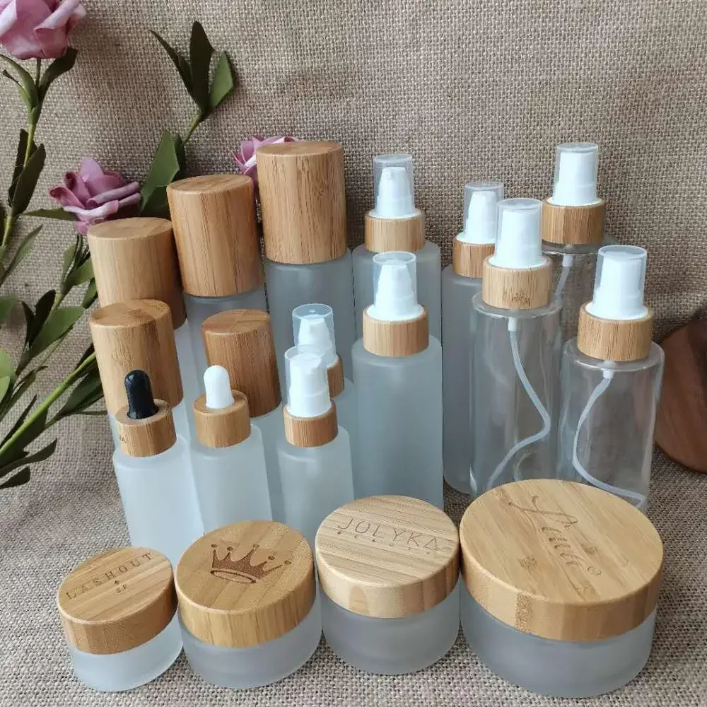 

popular selling frosted/clear glass bottle bamboo bottles with lotion/spray cap skin care ccosmetics container body cream jar