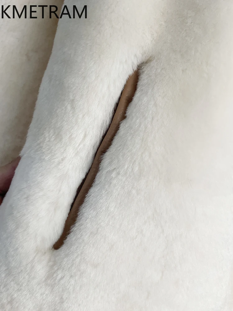 سترة من صوف ميرينو الطبيعي لعام 100% من جلد الغنم مزدوجة الوجه معطف نسائي فضفاض من الفرو الحقيقي ملابس شتوية للسيدات 2025