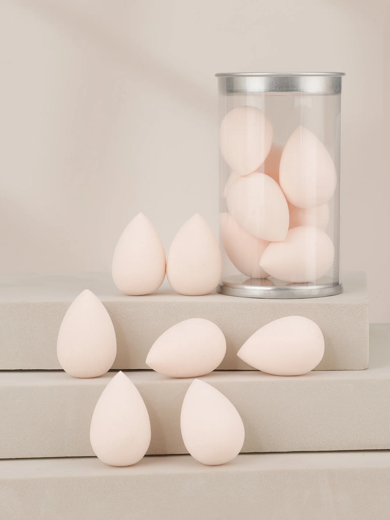 بيض تجميل صغير مع علبة تغليف بلاستيكية شفافة أسطوانية PVC
