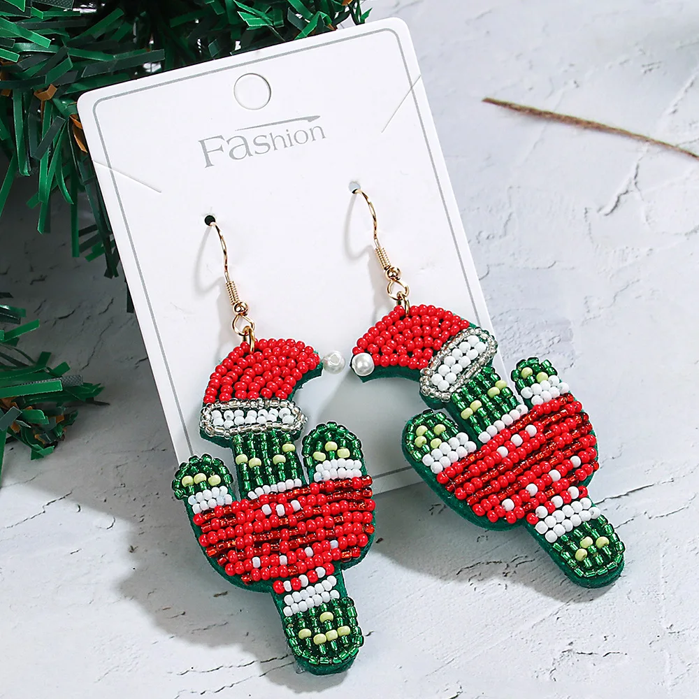 

Rice bead earrings Fabric Santa Claus Cartoon character Bohemia Tassels Hand weaving Alloy Female Fashion Simple Beaded earrings