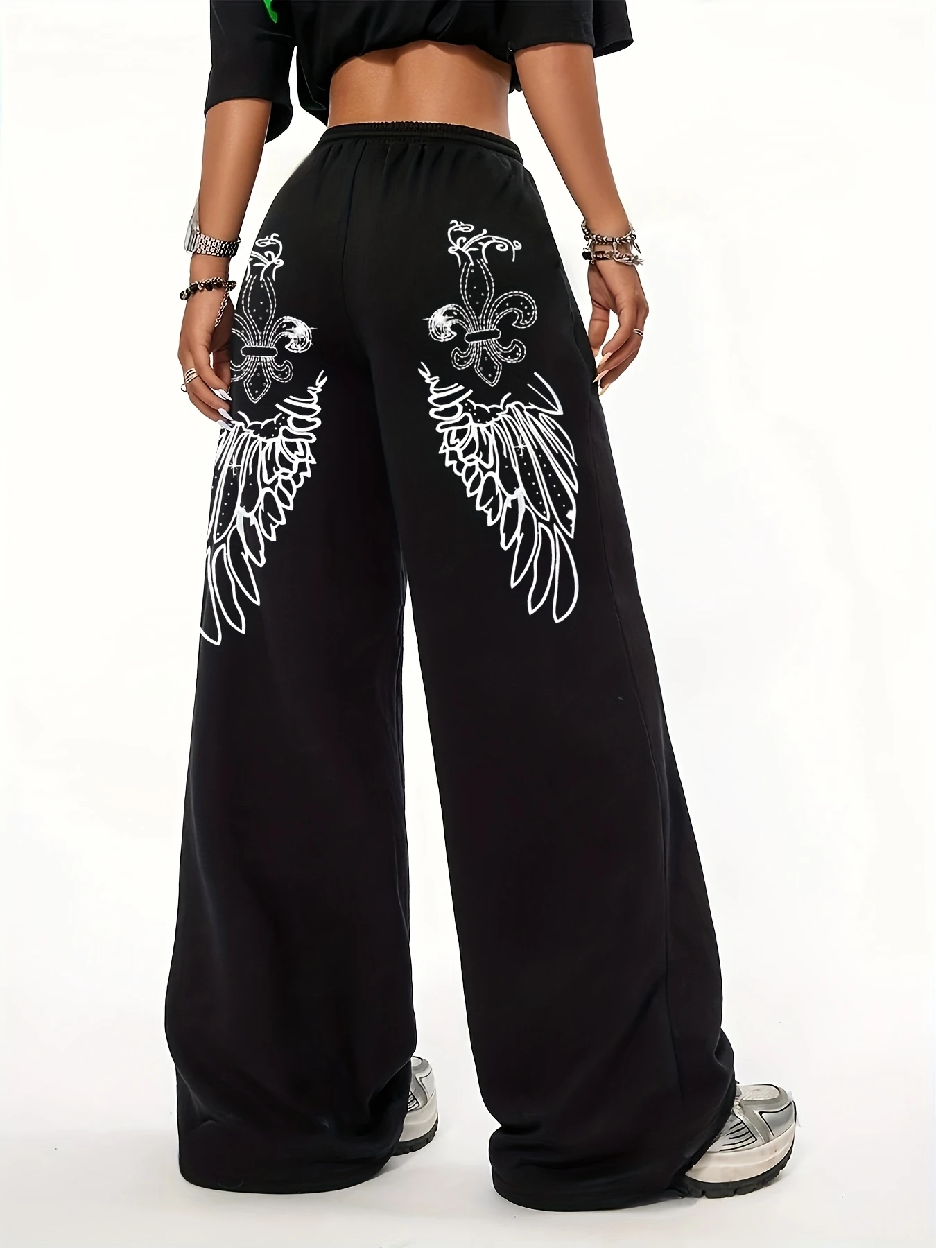 Damskie spodnie casualowe z wysokim stanem, prostymi nogawkami i unikalnym nadrukiem skrzydeł, elastyczna talia ze sznurkiem, możliwość prania w pralce - czarne