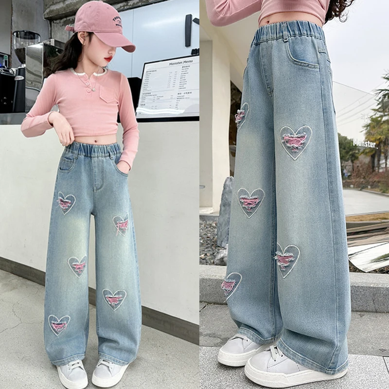 Nuevos pantalones vaqueros de moda para niñas, pantalones vaqueros de pierna ancha con diseño de agujero en forma de corazón rosa para niños de 4 a 12 años