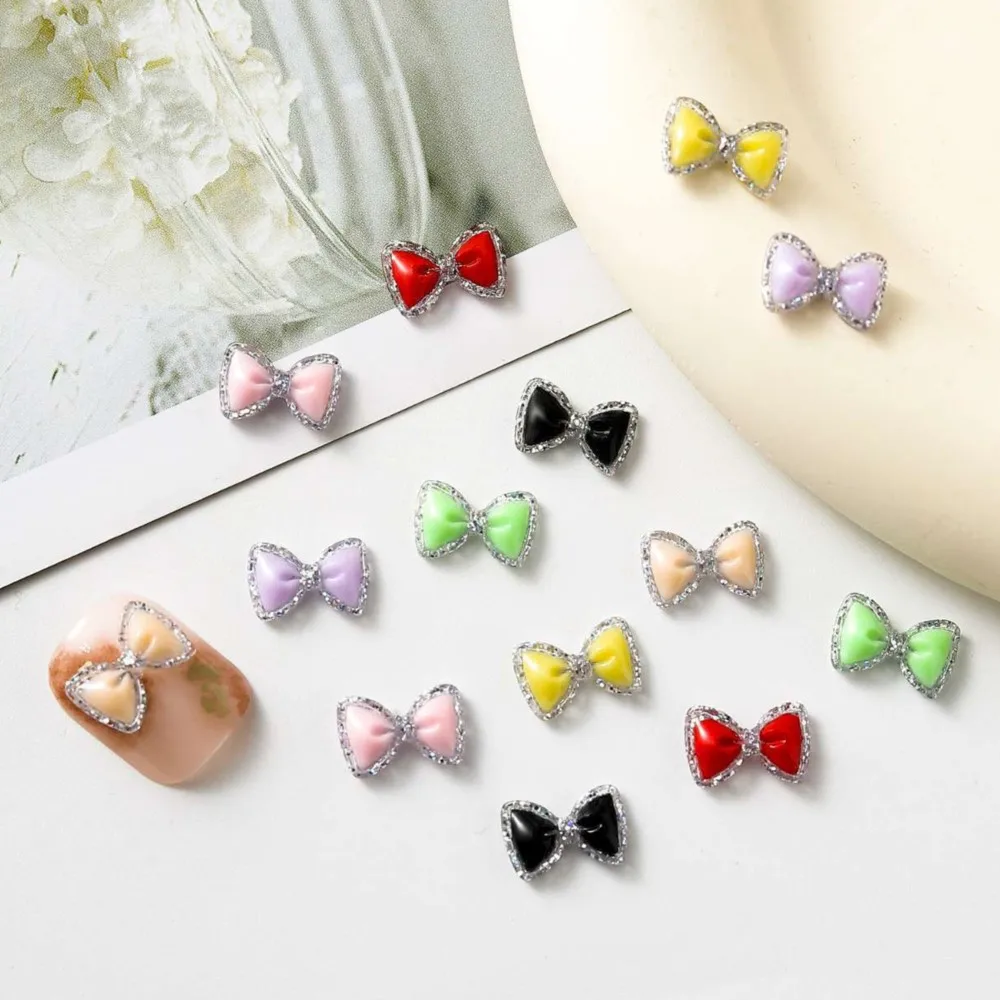100 Uds pajarita luminosa dijes para decoración de uñas lazo de resina brillante accesorios para decoración de uñas pajarita de lujo para artesanía de manicura funda de teléfono