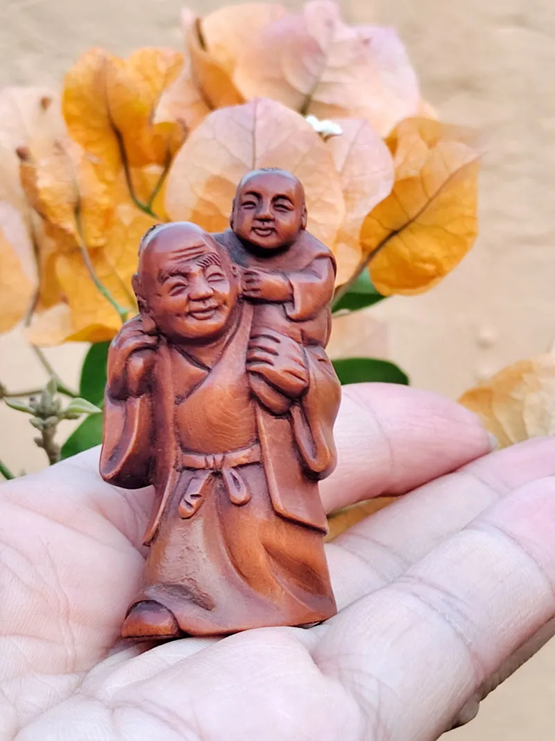 

GX1006 - 20 Years Old 2" Hand Carved Boxwood Netsuke : Elderman Carrying Kid