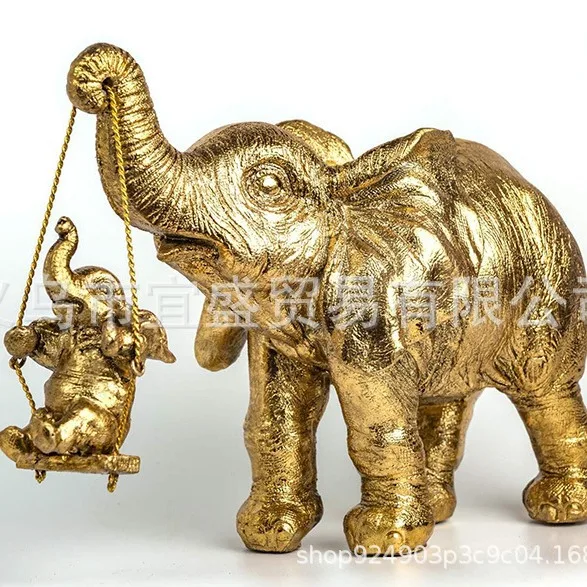 

‌Golden Elephant Cradle Figurine – Resin Home Decor, Baby Elephant Ornament, Decorative Accent
