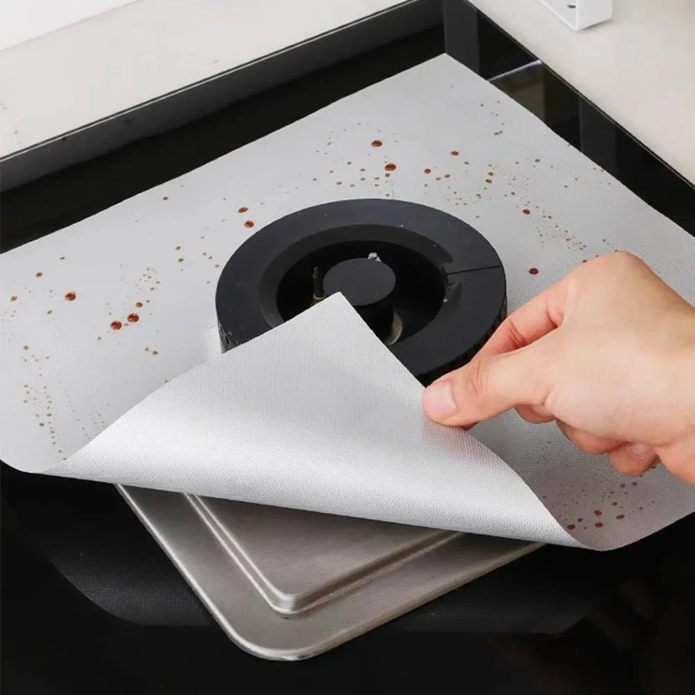 Gas stove covered with square heat-resistant, oil resistant, reusable stove protection pad, non stick stove lining kitchen tools