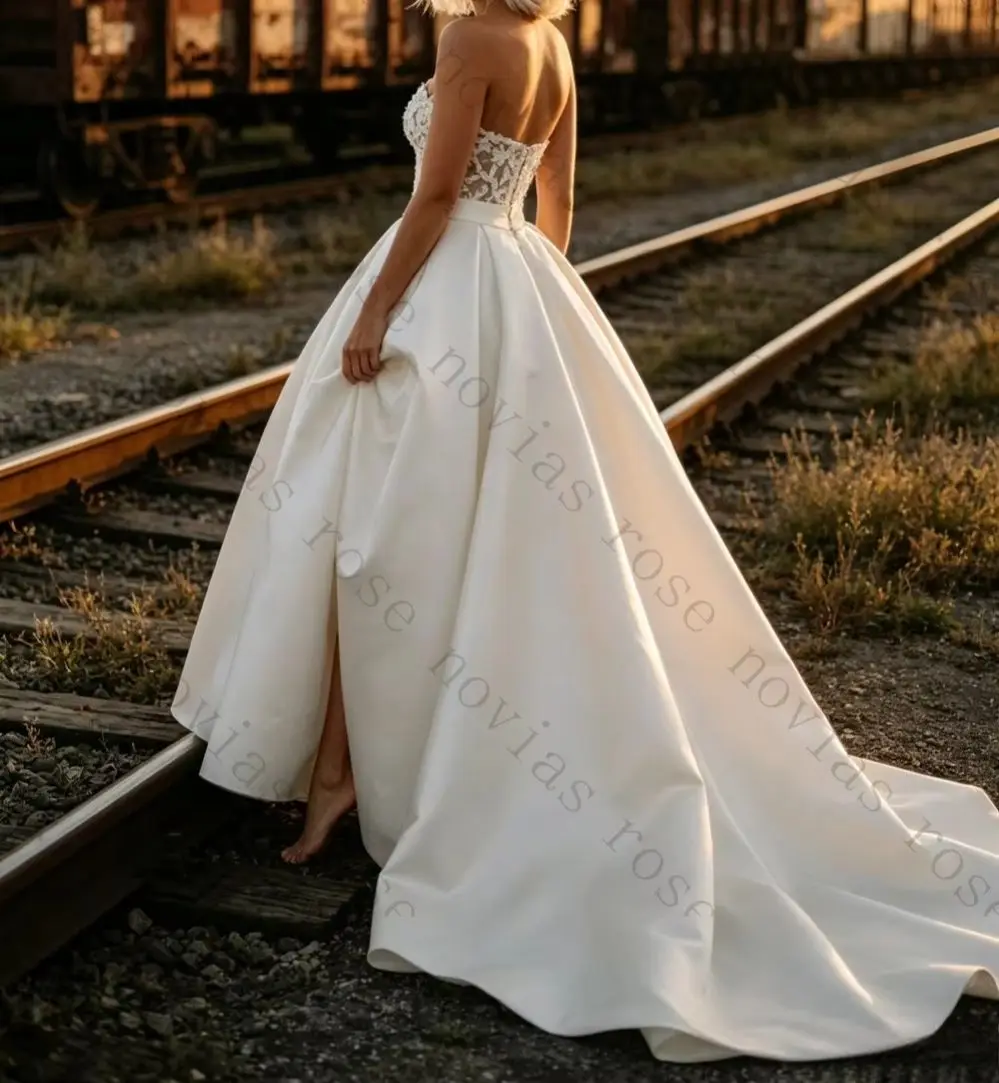 Customized 2026 Elegant Strapless Satin Princess Fluffy Wedding Dresses Luxurious Backless Lace Applique Ruffled Bridal Gown