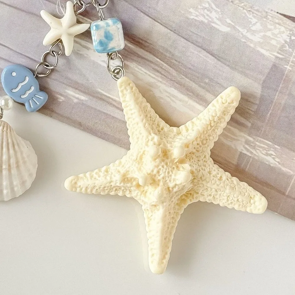 جديد قذيفة الطبيعية نجم البحر قذيفة المفاتيح مزلاج الباب الراتنج حقيبة الحبل نجم البحر الهاتف