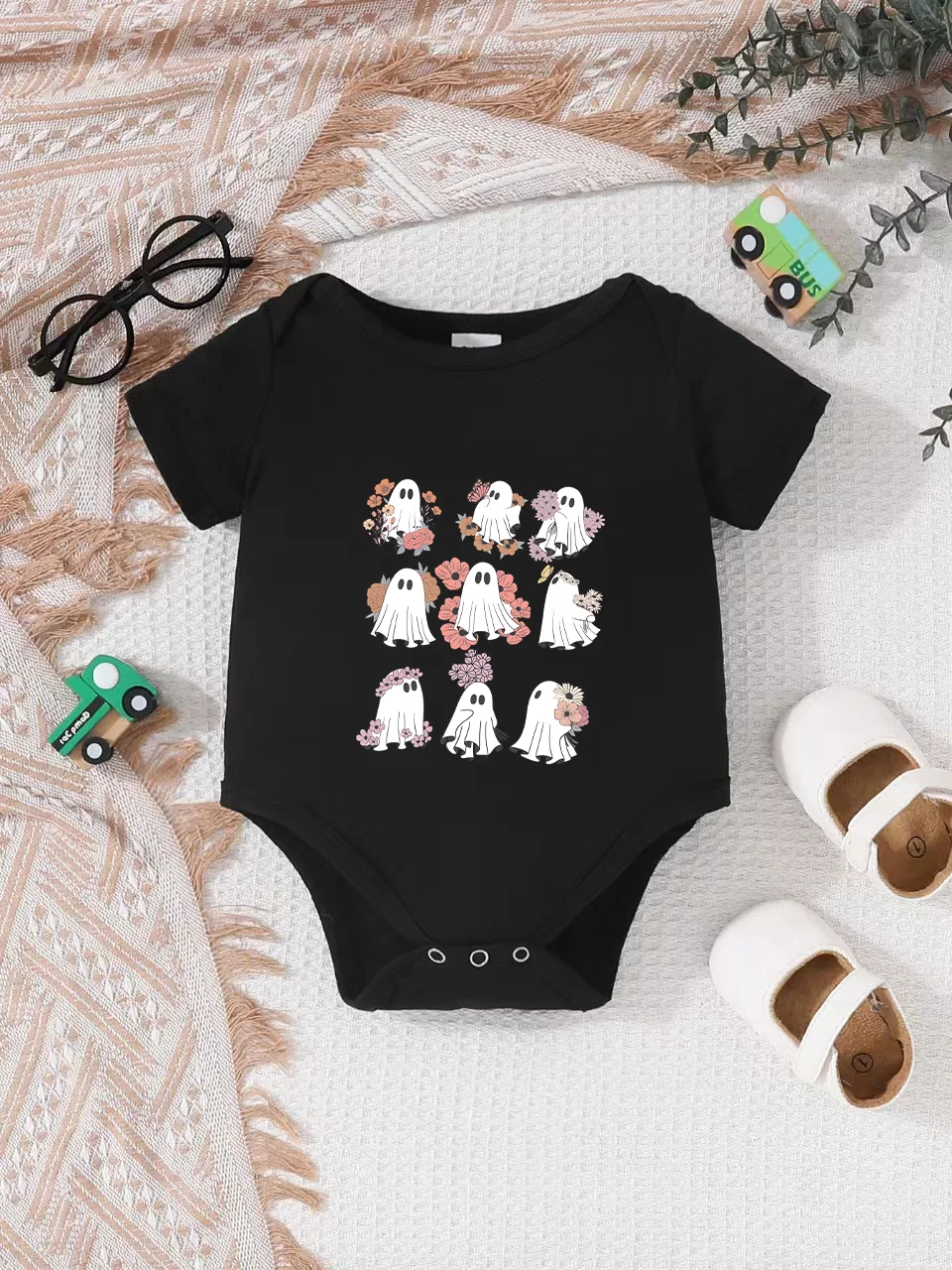 Playful letter-printed baby short-sleeve triangle bodysuit. Button closure for easy dressing, machine washable