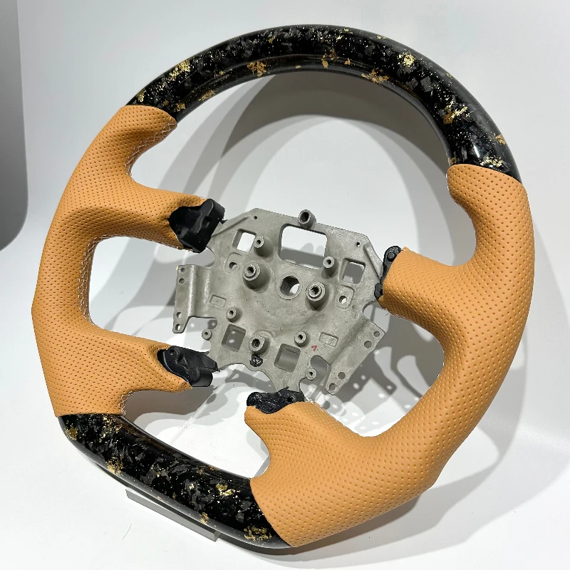 

Yellow perforated leather steering wheel with gold forged carbon fiber for Ford Falcon - Durable Performance Auto Accessory