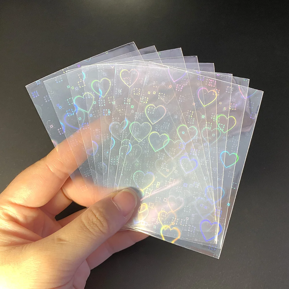 

100pcs Heart-shaped Laser Flashing Card Film Holographic Idol Photo Card Sleeves Tarot Ultra Super Protector Trading Card Cover