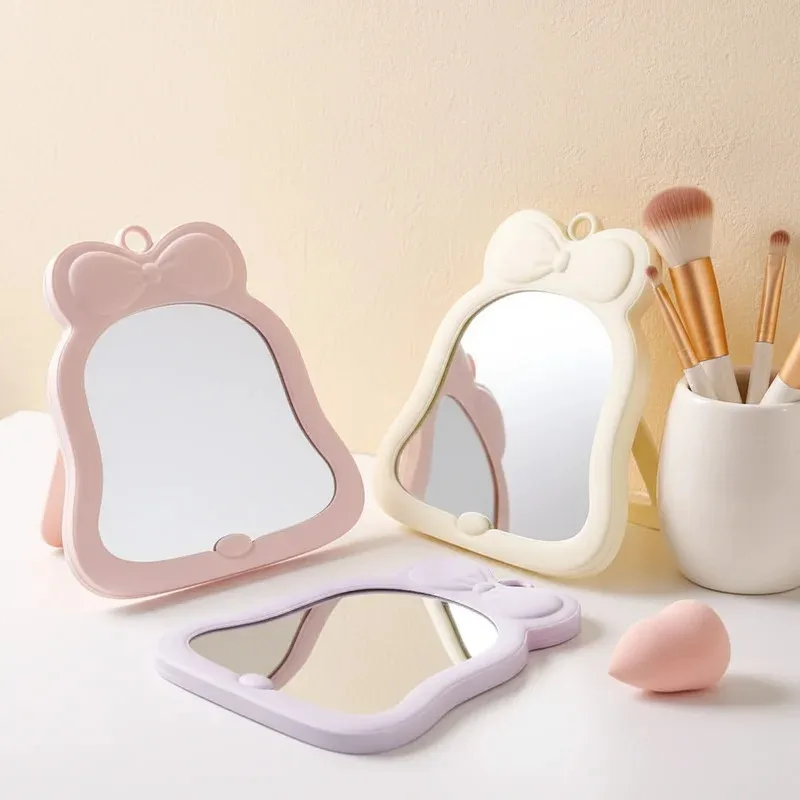 1 espejo de maquillaje de mano y de escritorio con lazo, espejo de bolsillo bonito y compacto para estudiantes, portátil, plegable, Simple, de Color sólido