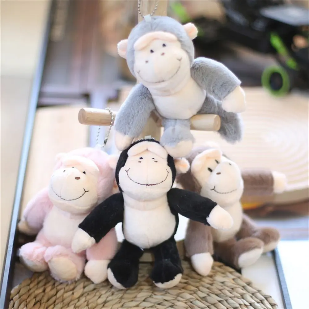 الحيوانات المحشوة سلسلة المفاتيح القرد أفخم دمية لينة الفراء قرد حلقة رئيسية حامل المفاتيح Kawaii Orangutan ألعاب من نسيج مخملي على ظهره الديكور