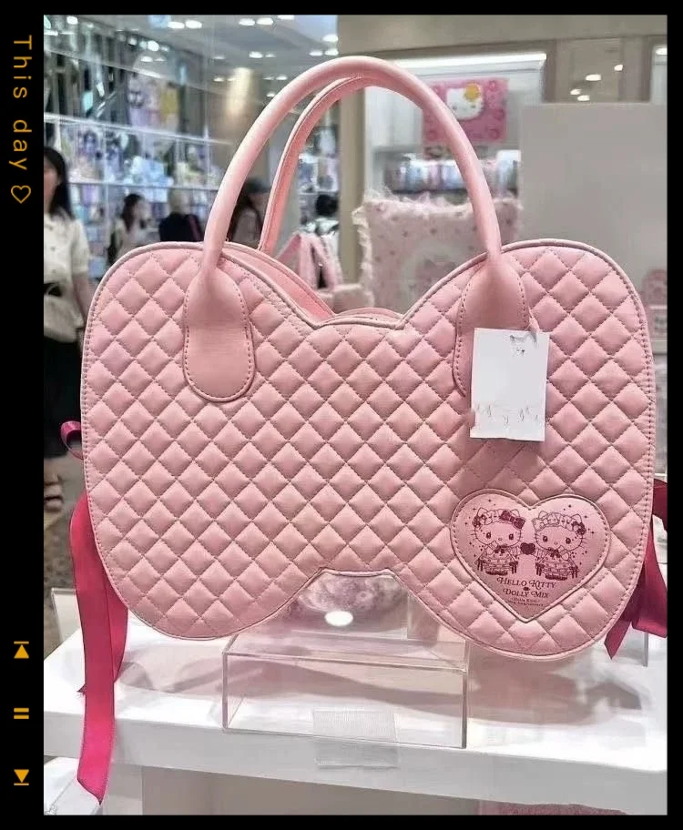 かわいいハローキティピンクのリボン付き携帯電話バッグ、アニメ周辺グッズハンドバッグ、PU素材のキュートでスイートな大容量バッグ、女性への誕生日プレゼント