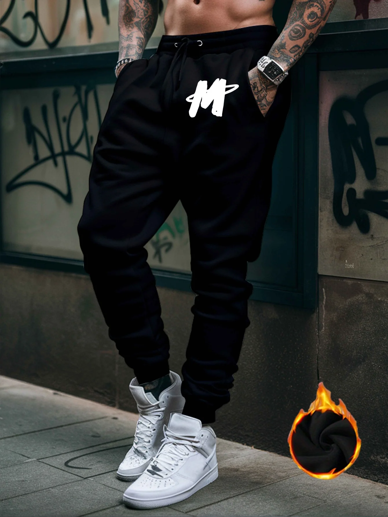 Graffiti‑styled hand‑drawn letter‑M mark graphic artwork stylish tapered fitted sweatpants men hip hop sports jogger trousers