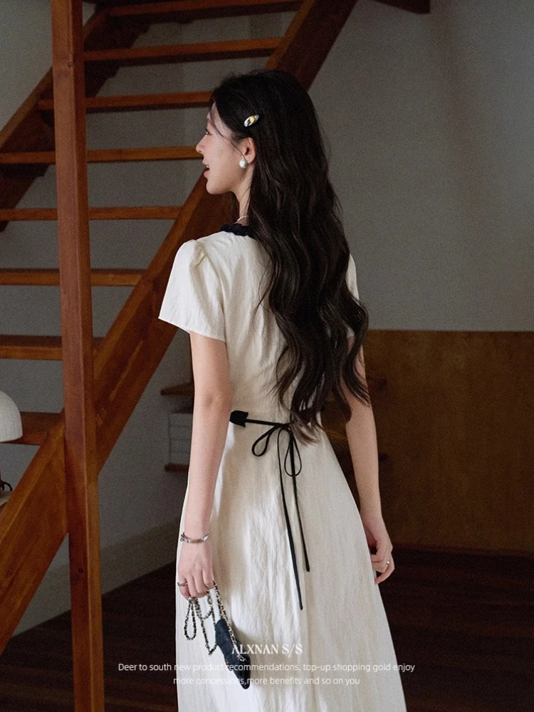 ALXNAN Beige Short Sleeve Dress with Bow Detail Black Lace Trim Pearl Buttons Waist-Defining A-Line Silhouette Summer DYL661967