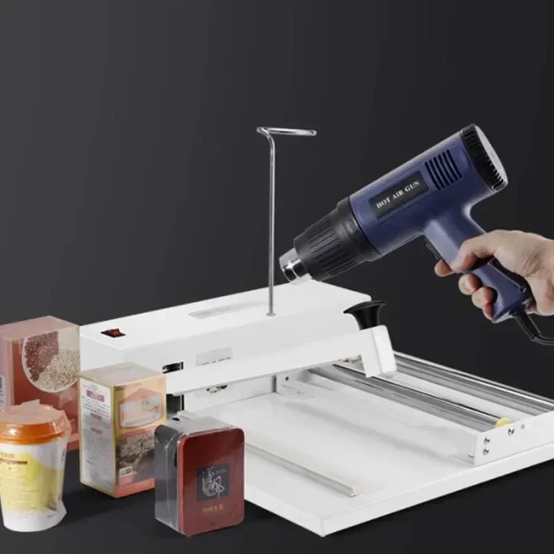 آلة الانكماش الجديدة الضغط اليدوي Pof فيلم الانكماش الحراري الصغيرة المنزلية التجارية آلة ختم الكتب آلة التعبئة والتغليف
