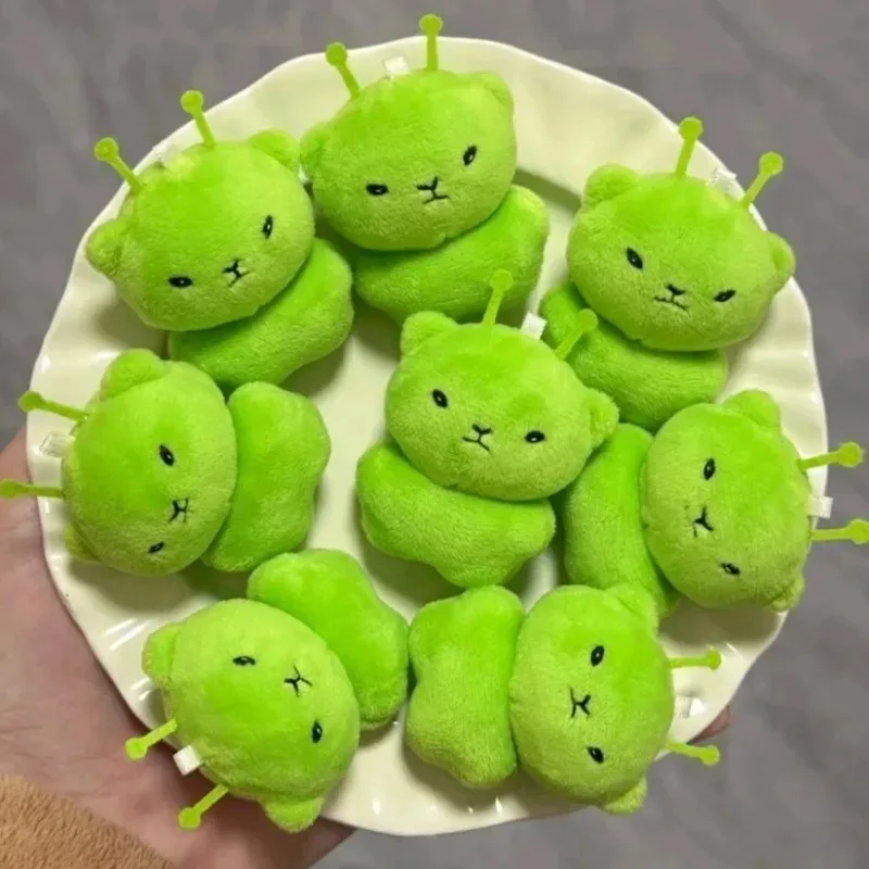1/12 piezas Muñeco de peluche de gato alienígena de dibujos animados, colgante de gato espacial verde, llaveros portátiles, decoración para bolsos, juguetes de moda, regalos sorpresa
