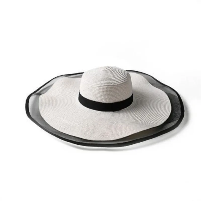 A wide-brimmed sun-protective hat for women seaside vacation and fashionable versatile fisherman's to cover the face