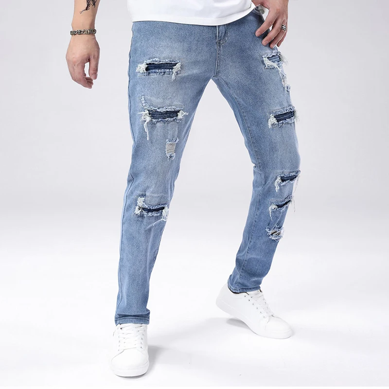 Jeans strappati skinny azzurri autunnali da uomo Pantaloni lavati vintage a media elasticità Pantaloni alla moda casual alla moda quotidiana