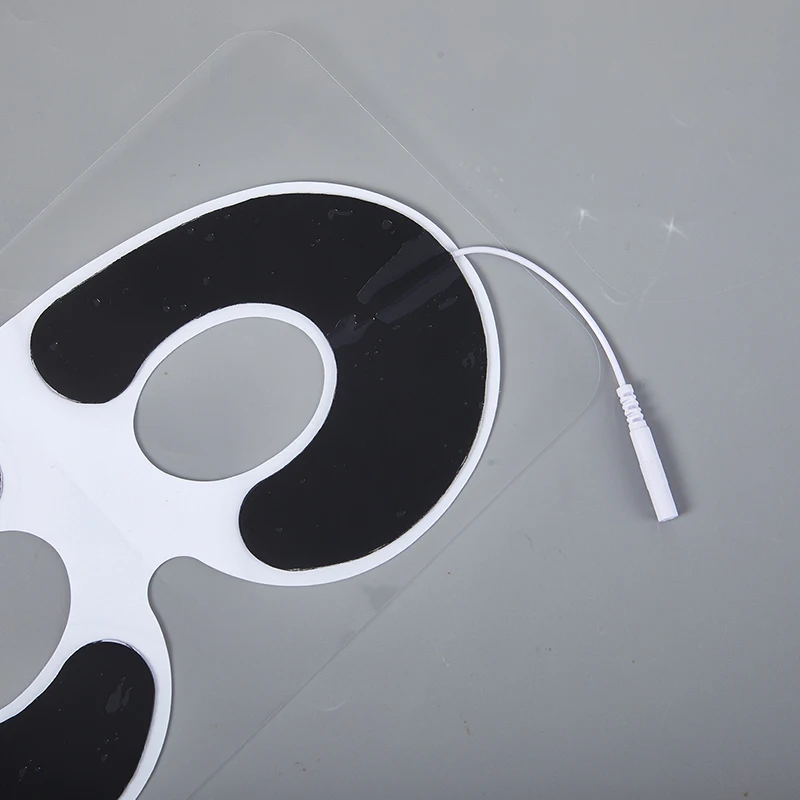 غير المنسوجة ذاتية اللصق EMS قناع عين غطاء عشرات القطب الوسادة لمدلك العلاج بالنبض الإلكتروني مع ثقب التوصيل