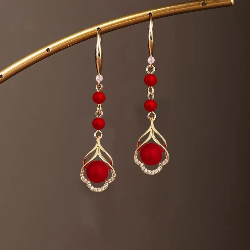 

Red festive earrings with Chinese style and festive temperament for women, long, internet famous ear cuff buckle