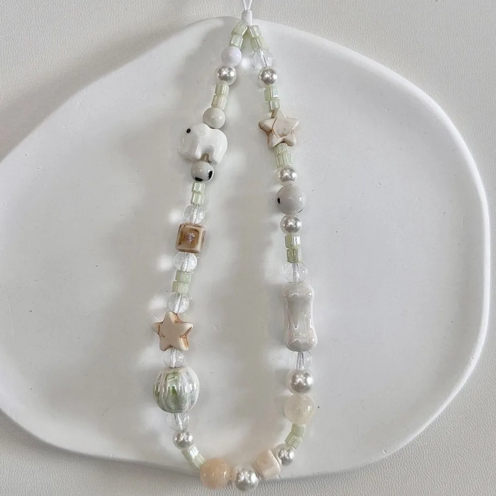 The Cute Milk White Set along with Elephant Beaded Phone Chain, Polaroid CCD Hanging Rope, Safety Rope, Handheld